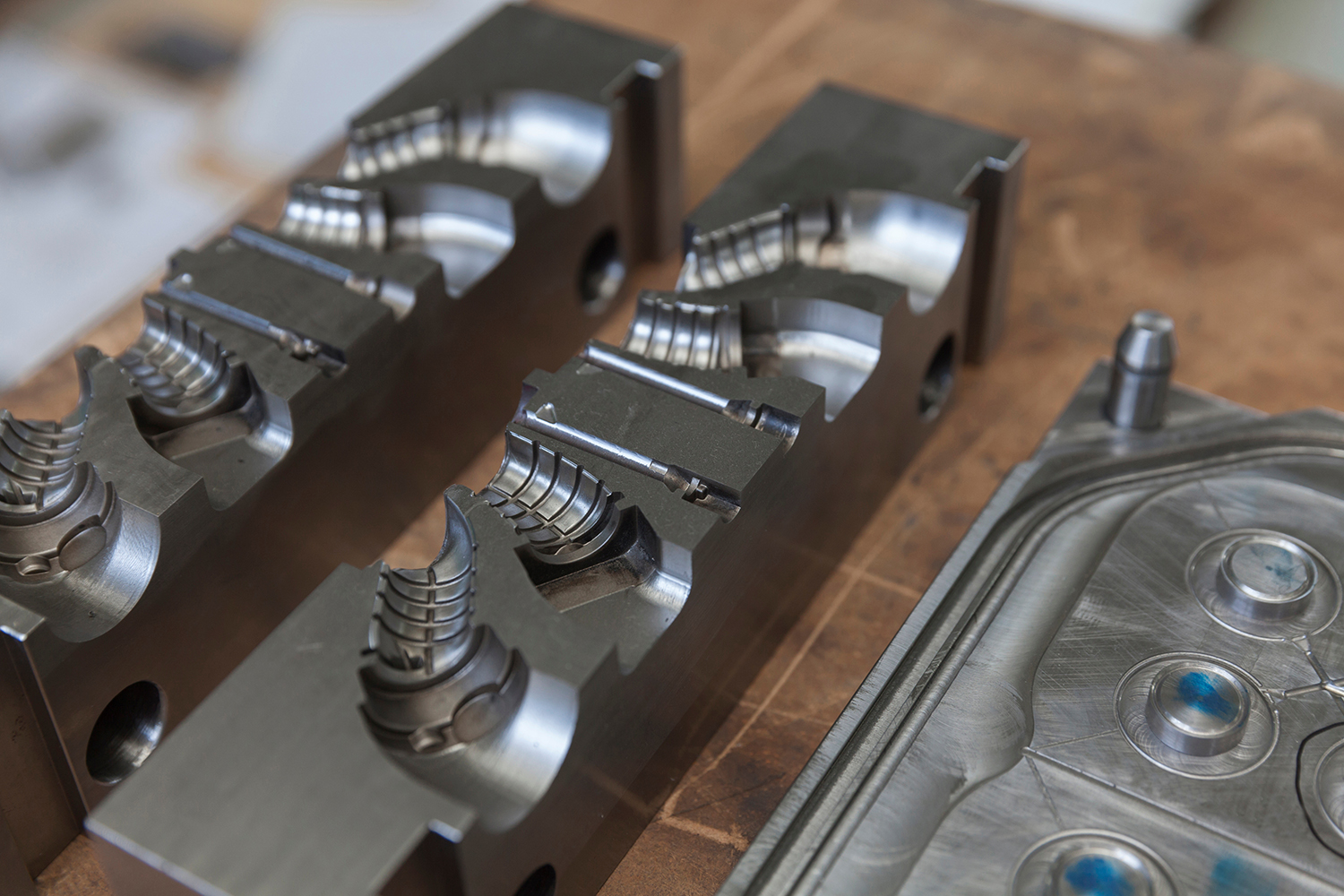 A closeup of a set of metal molds set aside for storage
