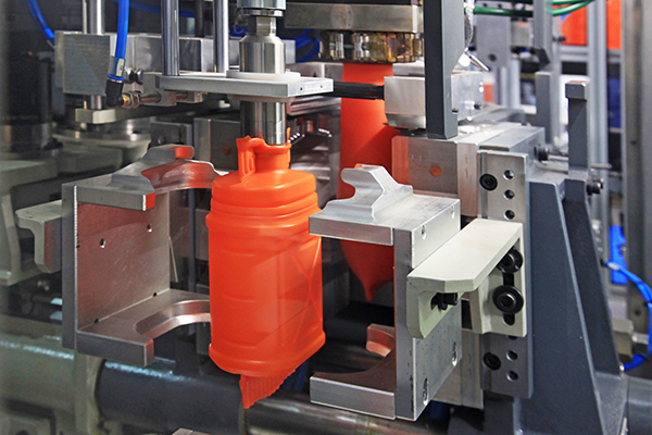 AdobeStock_287551852 An orange bottle molded from thermoplastic