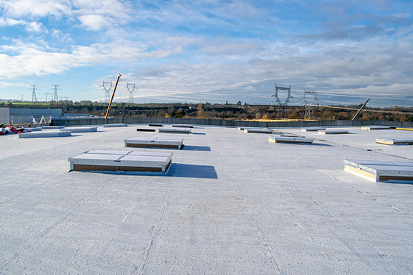 decreases-scrap-parts A flat roof created with extruded EPDM rubber roof tiles
