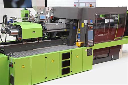 A lime green injection molding machine