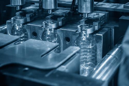 PET bottles in an automatic blow molding machine.