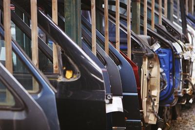 Metal car doors of all colors on the manufacturing line